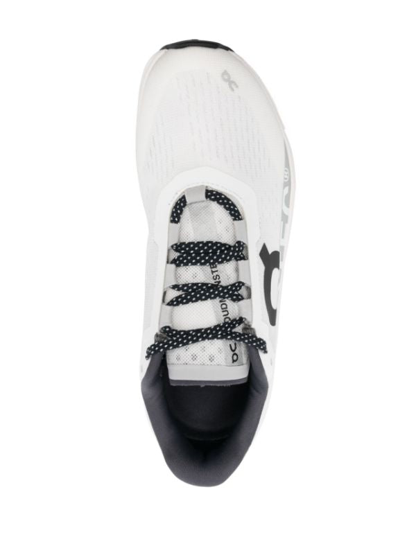 On Running tenis Cloudmonster blanco negro