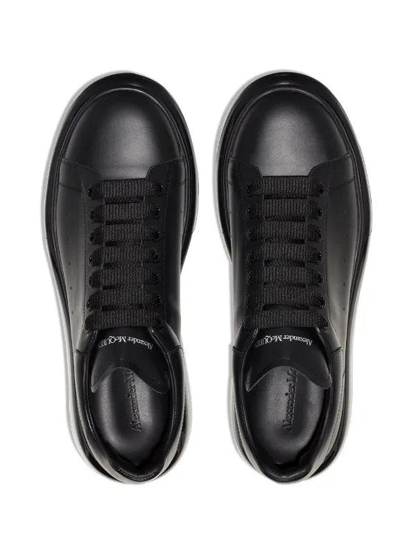 Alexander McQueen tenis mid-top con suela transparente